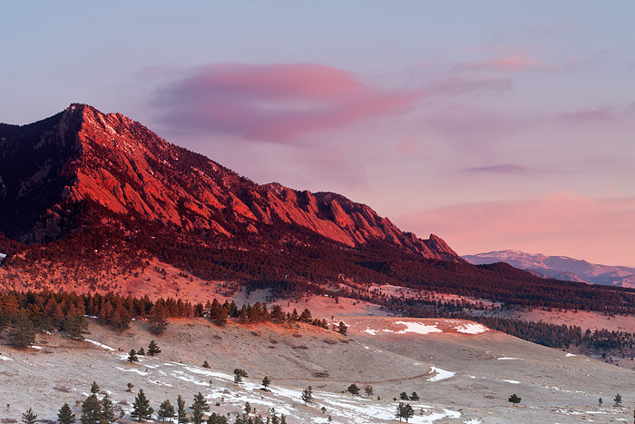 The Flatirons of Boulder, Colorado light up at Sunrise